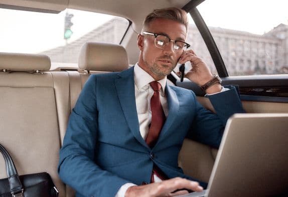 person working remote in car