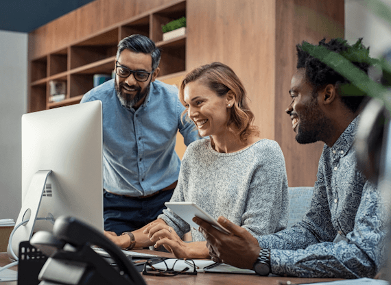 group of people looking at computer
